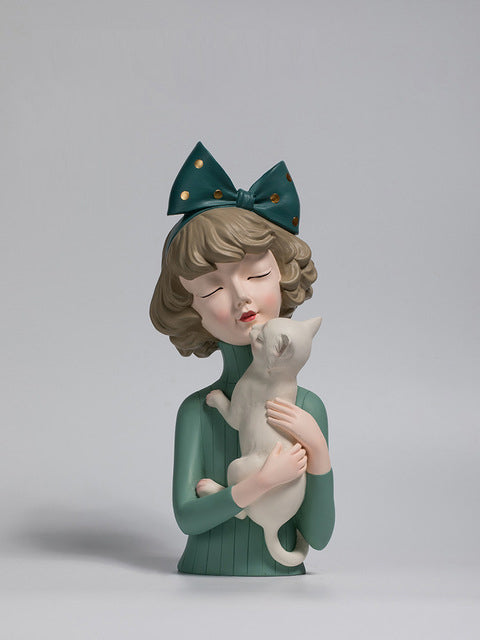 Girl with a kitten sculpture